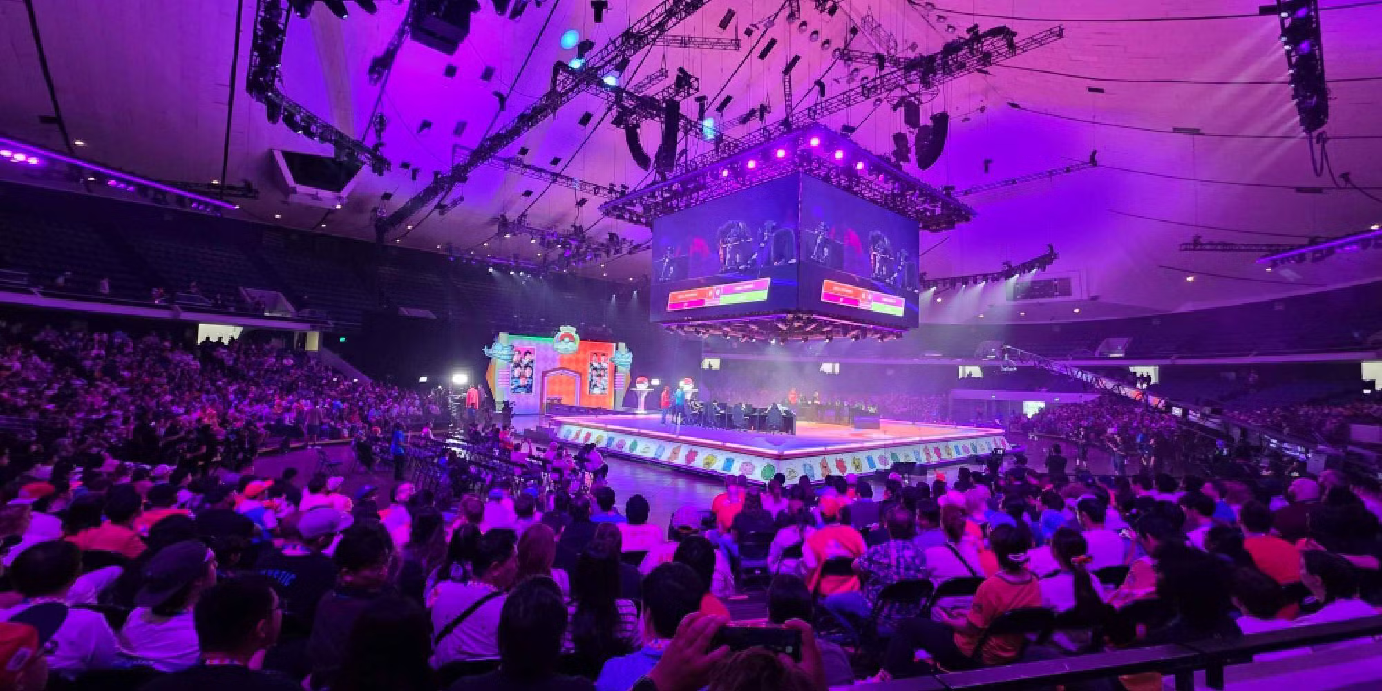 Competitors seated at tables during a Pokémon International Championships tournament